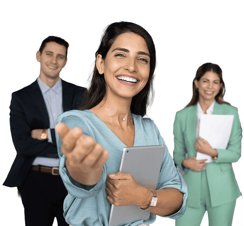 A smiling professional holding a tablet and gesturing in welcome, with two colleagues behind her.